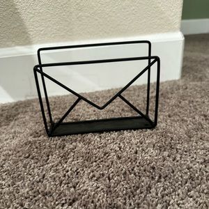 Black metal mail holder